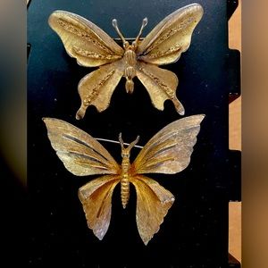 2 BSK butterfly brooches.